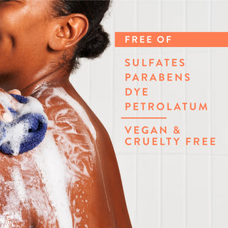 Person lathering in shower with text reading “Free of sulfates, parabens,  dye, petrolatum, vegan & cruelty free”