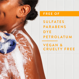Person lathering in shower with text reading “Free of sulfates, parabens,  dye, petrolatum, vegan & cruelty free”