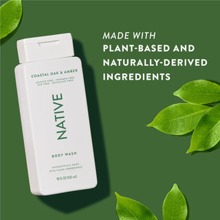 Native Coastal Oak & Amber Body Wash with text reading “Made with plant-based and naturally-derived ingredients” next to green leaves