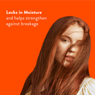 Woman with long red hair with text reading “Locks in moisture and helps strengthen against breakage”
