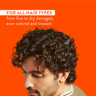 Man with curly hair and text reading “For all hair types from fine to dry damaged, even colored and treated”