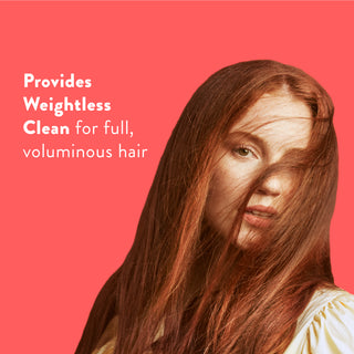 Woman with long red hair with text reading “Locks in moisture and helps strengthen against breakage”