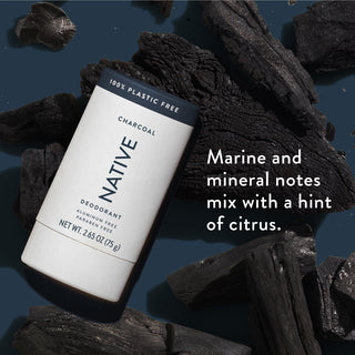 Native deodorant with text saying "Marine and mineral notes mix with a hint of citrus", styled with charcoal