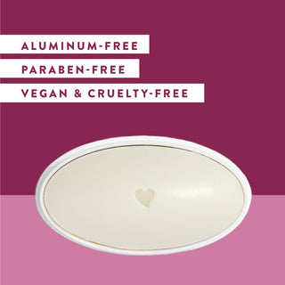 Inside of Native Blackberry & Green Tea deodorant laid flat on pink background