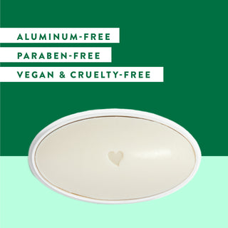 Inside of Native Eucalyptus & Mint deodorant laid flat on a green background