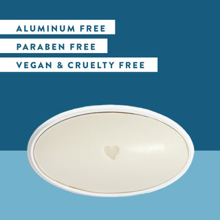 Inside of Native Sea Salt & Cedar deodorant laid flat on blue background