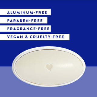 Inside of Native Unscented deodorant laid flat on blue background