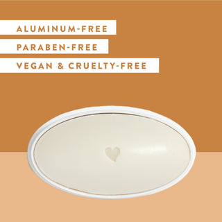 Inside of Native Vanilla & Sandalwood deodorant laid flat on brown background