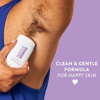 Man applying Native Lilac & White Tea Whole Body Deodorant Stick underarm with clean & gentle formula for happy skin text overlay