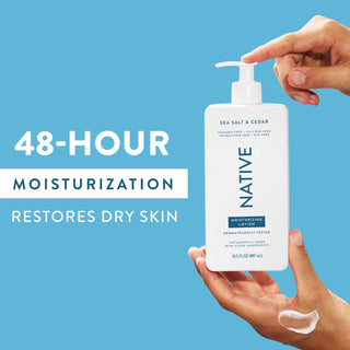 Hand pumping Native Sea Salt & Cedar Moisturizing Lotion bottle, with “48-Hour Moisturization restores dry skin” text