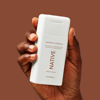 Hand holding Native Body Wash in Coconut & Vanilla Scent 3 fl oz