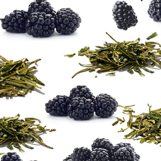 Arrangement of blackberries and small green tea leaves piles
