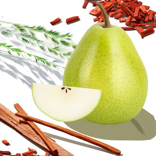 Arrangement of a pear and a pear slice with wood sticks and desert grass in the background