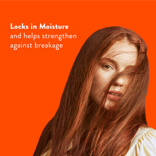 Woman with long red hair with text reading “Locks in moisture and helps strengthen against breakage”