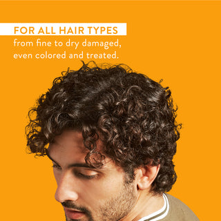 Man with curly hair and text reading “For all hair types from fine to dry damaged, even colored and treated”