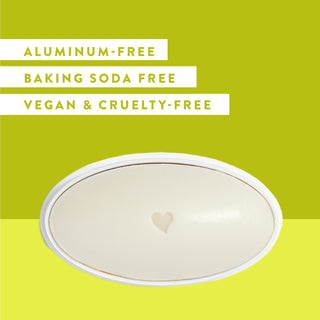 Inside of Native Aloe & Green Tea sensitive deodorant laid flat on green background