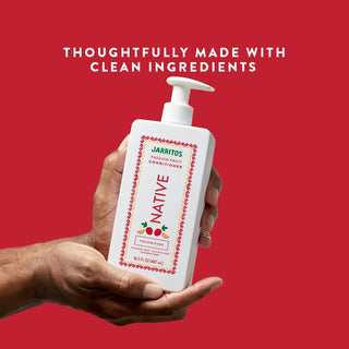 Hands holding Native Volumizing Conditioner with text “Thoughtfully made with clean ingredients”