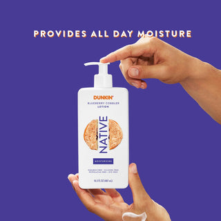 Hand pumping Native Dunkin - Blueberry Cobbler Moisturizing Lotion bottle, with “Provides all day moisture” text