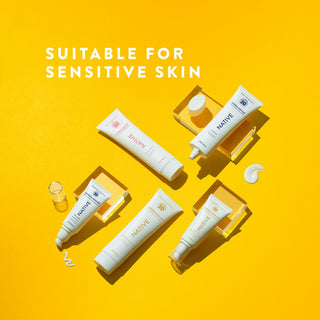 Several Native Mineral Suncare tubes arranged on a bright yellow surface, labeled suitable for sensitive skin